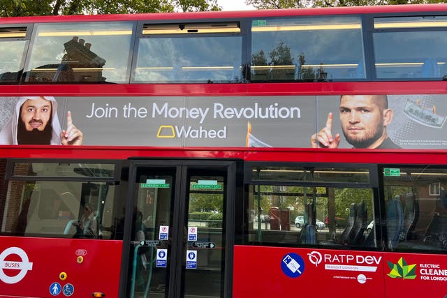 <p>A poster of one of six ads for an Islamic investment platform showing US dollar and Euro banknotes on fire which have been banned</p>