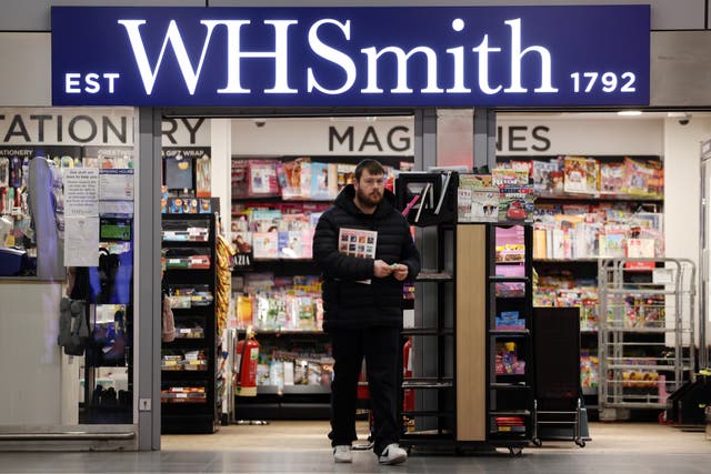 <p>A customer at a WHSmith store in London on Saturday</p>