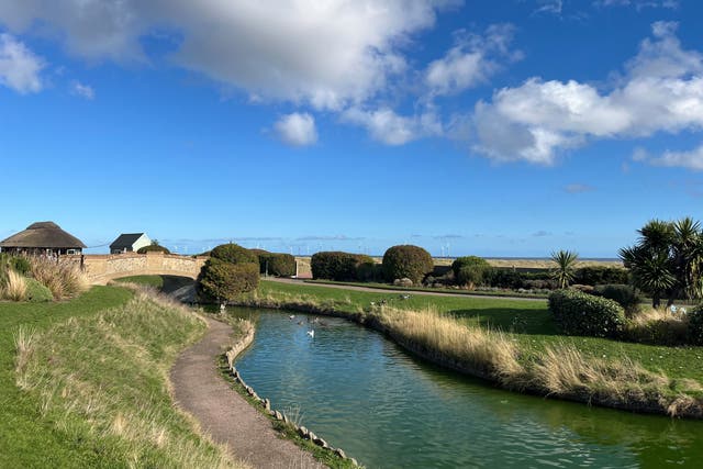 <p>Tourists can take a scenic stroll through the carefully manicured gardens at Great Yarmouth’s Venetian Waterways</p>