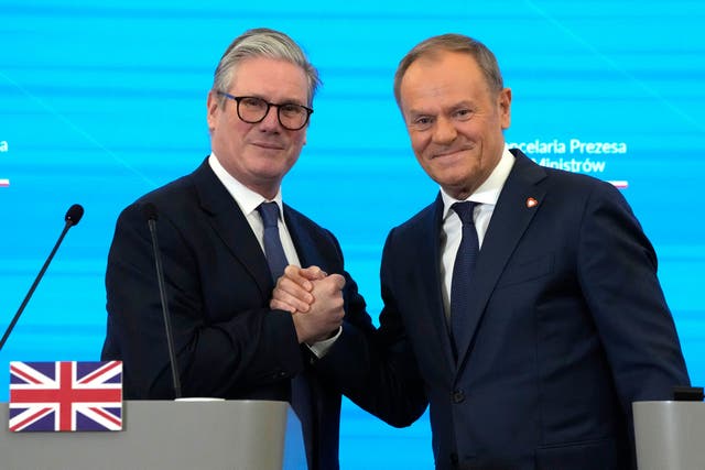 Prime Minister Sir Keir Starmer and Polish Prime Minister Donald Tusk shake hands after a press conference in Warsaw (Czarek Sokolowski, Pool/AP)