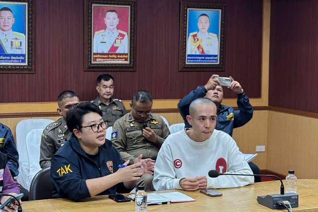 <p>Chinese actor Wang Xing, right, talks with Thai police officers in Mae Sot district, in Thai-Myanmar border</p>