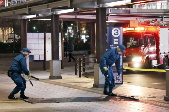 <p>Police officers at the scene of the stabbing attack in front of the JR Nagano Station in central Japan</p>