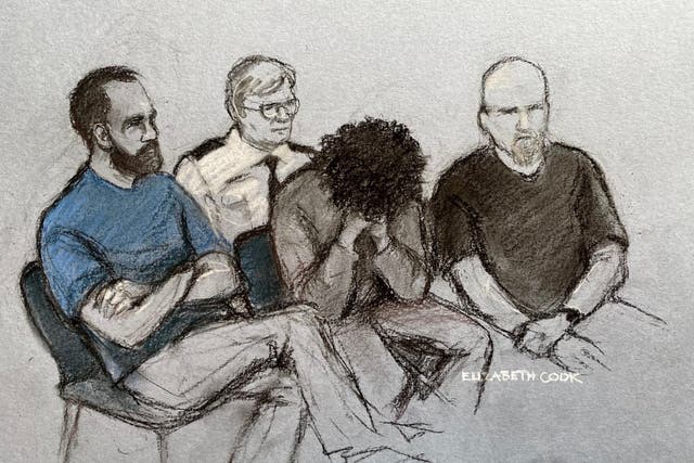 <p>Axel Rudakubana (centre) covering his face at an earlier court appearance (Elizabeth Cook/PA)</p>