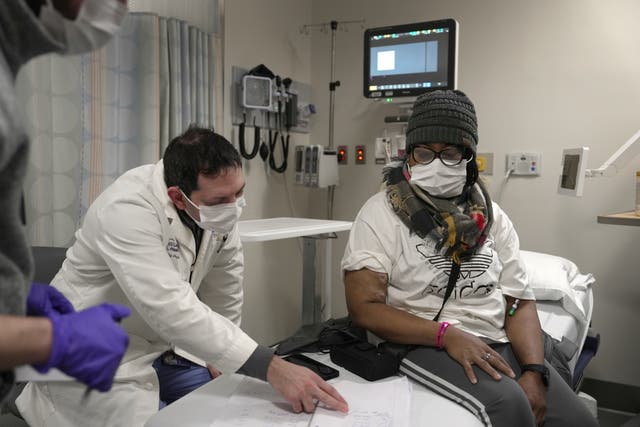 <p>Towana Looney, who received a pig kidney transplant in November 2024, goes over notes about her recovery with Dr. Jeffrey Stern at NYU Langone Health in New York. She has lived for 61 days with the pig organ inside her </p>