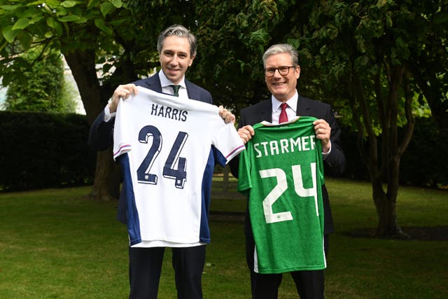 <p>Simon Harris and Keir Starmer swap personalised jerseys as the respective prime ministers of Ireland and Britain meet in Dublin before September’s football international between Ireland and England</p>