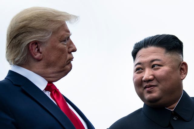 <p>File. Donald Trump and Kim Jong Un talk before a meeting in the Demilitarized Zone, Korea, on 30 June 2019</p>