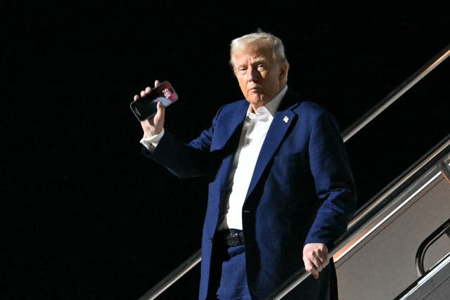 <p>President Donald Trump waves as he steps off Air Force One in Las Vegas. He is taking credit for the most recent Israeli hostages being released from Hamas </p>