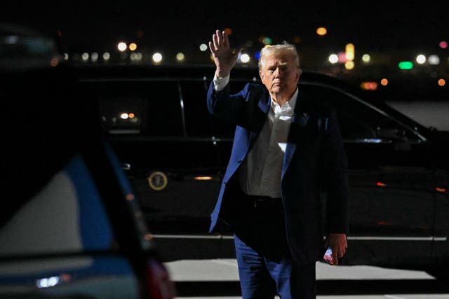 <p>President Donald Trump waves after stepping off Air Force One upon arrival at Harry Reid International Airport in Las Vegas. On Friday night, he fires several government watchdogs </p>