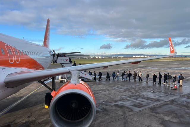 <p>Going places: Passengers boarding an easyJet flight from Belfast City airport to London Gatwick</p>