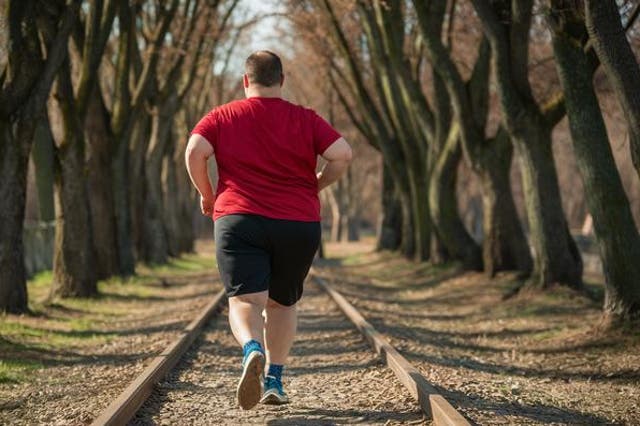 <p>Adult with obesity practicing running</p>