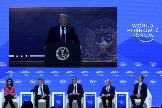 <p>President Donald Trump appears on a screen during the 55th annual World Economic Forum (WEF) meeting in Davos, Switzerland</p>