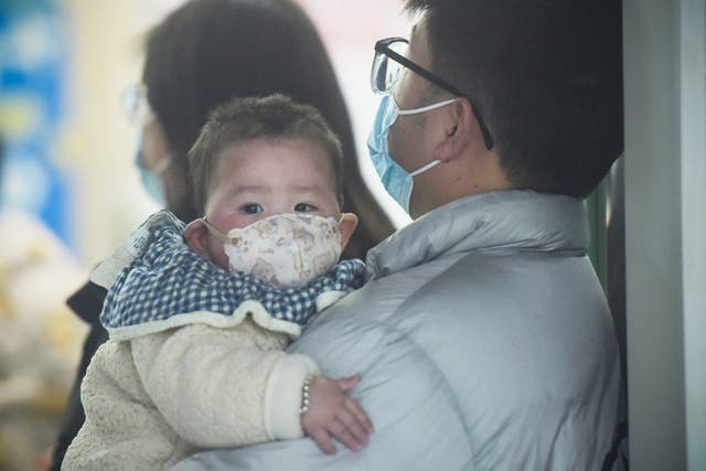 <p>A parent and child visit a doctor in Hangzhou, China </p>