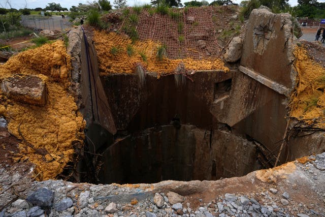 <p>An abandoned gold mine, where miners were rescued from below ground, in Stilfontein, South Africa</p>