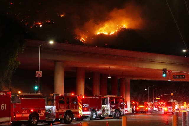 <p>Apparatus sits on Sepulveda Blvd. as fire burns along the busy Interstate 405 in Los Angeles, California, on Thursday. </p>