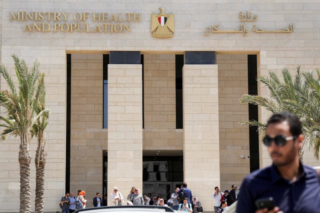 <p>Employees walk after work, outside the new building of Egypt’s Ministry of Health and Population (MoHP) in the New Administrative Capital (NAC), east of Cairo, Egypt</p>